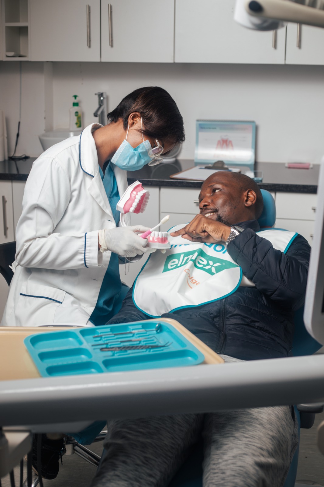 Dentist welcoming a patient at Smile Street Dental Care